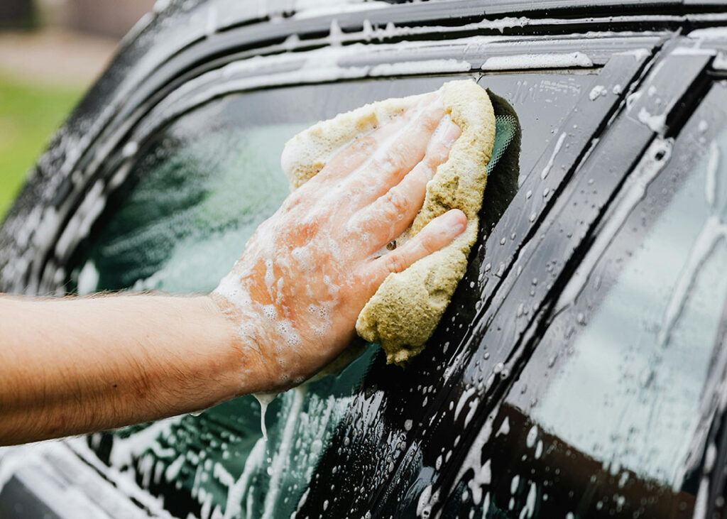 Hand washing and waxing car windows